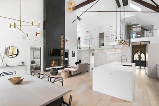 Traditional Churches Become Modern Homes - Photo 3 of 10 - An old church in Chicago, Illinois was handed over to Linc Thelen Design and Scrafano Architects to be converted into a modern home for a family with three young children. The 25-foot ceilings, white surfaces, and wood floors make the space feel grand without being overwhelming or overdone.