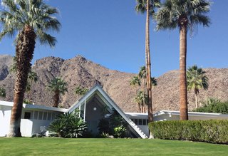 8 Iconic Houses in Palm Springs, California - Photo 6 of 8 - With a triangular A-frame front, similar to that of a Swiss ski chalet, the Swiss Miss houses were designed by Charles Dubois in a section with about 15 other homes just like it. The unusual front spans two-stories tall giving the home some dramatic curb appeal.