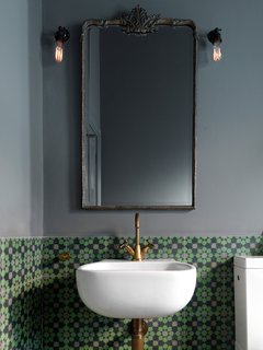 11 Examples of How to Incorporate Traditional Building Materials Into Your Modern Home - Photo 5 of 12 - Brightly-colored encaustic tile has a matte finish that contrasts with the glossy white of the bathroom fixtures.