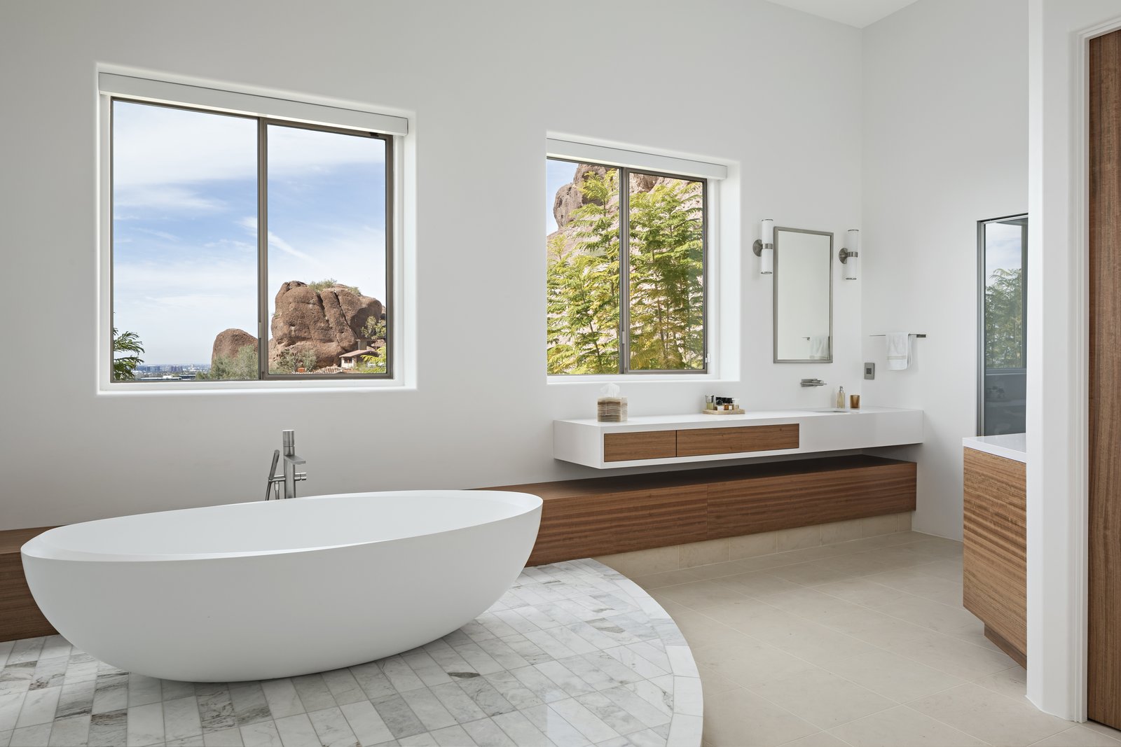 Freestanding tub and custom vanities with views of Camelback Mountain