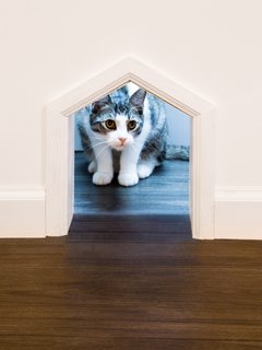 This small mousehole is a perfect getaway to a cat only section of the cat cafe