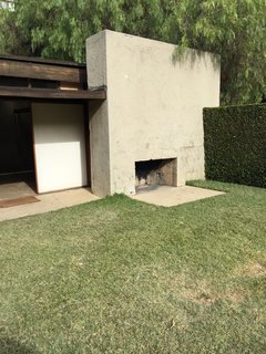 One of the multiple outdoor fireplaces used year-round for entertaining guests. 