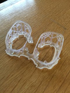 3D-printed frames for eye-glasses are thinner, more flexible and printed faster with the SLS method. You can also see the support "trees" that will be broken off, leaving just the delicate frames. 