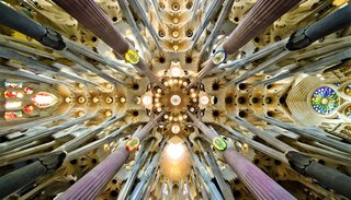 Slow Architecture - Photo 6 of 11 - Sagrada Família Basílica & Temple / Detail of the roof in the nave. Gaudí designed the columns to mirror trees and branches.