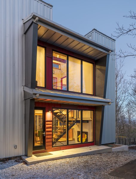 Elements such as solar design, triple pane Zola windows, energy efficient appliances, a rainwater catchment system that supplies all the water and healthier eco-friendly materials – repurposed bowling alley lanes for countertops and recycled wood used throughout – are just a few of the sustainable features incorporated into this innovative design approach. Photo 11 of Love Shack modern home