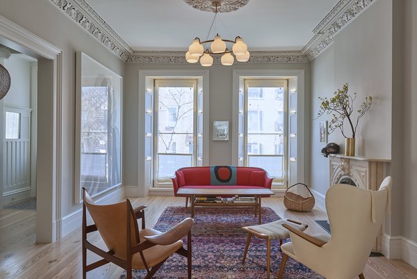 Parlor: A Vilhelm Lauritzen hangs above a Vintage Moroccan rug from Breuckelen Berber. A Finn Juhl Chieftain Chair alongside a Mama Bear Chair; reupholstered and paired with a matching ottoman in Hella Jongerius fabric sit next to a Hans Wegner coffee table.
Ceiling decoration is original – parts of it replicated by Absolute Plastering in Brooklyn.
Zola ThermoClad Finger-Jointed Pine Window.
http://www.zolawindows.com/thermoclad/ Photo 8 of Carroll Gardens Passive House modern home