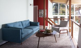Styling a Rescued Mid-Century Gem - Photo 2 of 6 - Built in 1953, the Friedman House features a unique loft space that overlooks the open-concept first floor. Decorated in some of our most mid-century modern pieces, it's like taking a step back through time. <span style="color: rgb(204, 204, 204); font-size: 13px;">Photo: Philippe Martin-Morice</span>