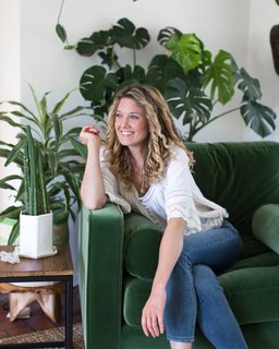 A statement velvet green armchair (the Article Sven in Grass Green) looks perfectly at home amongst Jenny’s plants and artwork.