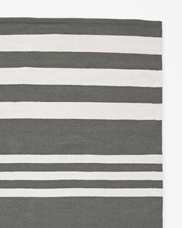 This Insanely Cool Loft Is What Downtown Dreams Are Made Of - Photo 10 of 29 - Serena & Lily "Hamptons All-Weather Rug" ($998)