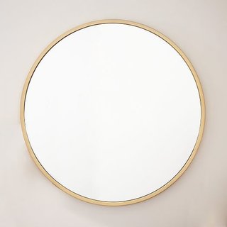 Tour an Insanely Stylish NYC Loft With Major Scandinavian Vibes - Photo 4 of 19 - West Elm Metal Framed Oversized Round Mirror ($499)