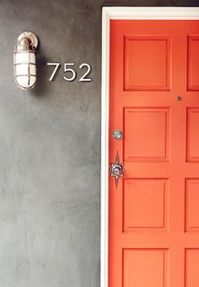 What's the Best Color to Paint Your Front Door? Your Guide to Finding The One - Photo 5 of 22 - This front door should be all the proof you need to decide that when it comes to doors, orange is the new black. It might be brunch feelings talking, but the bright hue reminds me of a perfect blood-orange mimosa. Needless to say, I've personally got a little orange crush on this one.