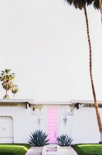 What's the Best Color to Paint Your Front Door? Your Guide to Finding The One - Photo 3 of 22 - Hello from the outside. This inspiring midcentury pink door is just the right hue for a design style that's retro with a little bit of feminine flair. The bright shade hits the sweet spot between bubblegum and blush for pure Palm Springs perfection.