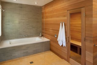 10 Sterling Saunas in Modern Homes - Photo 6 of 9 - Natural wood warms the stone palette of this master bathroom designed by Mark Reilly Architecture.
