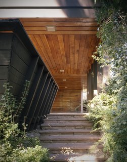 An Architect in Her Own Wright - Photo 1 of 4 - This is the first of two homes designed for the Vradenburg family by Ingraham and Ingraham, Architects. The overhang here serves as both coverage for the entrance and carport. Like Frank Lloyd Wright's designs, Ingraham tucked away her unusual entrances from obvious view. 
