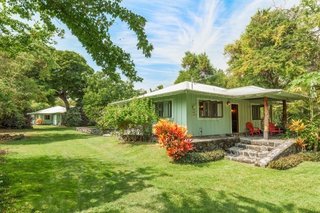 The sale includes two adjacent lots, each with a classic beach cottage in view of the ocean 