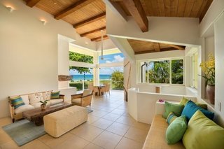 Hanalei Bay Villa – Contemporary Home on Hanalei Bay Offering Art & History - Photo 9 of 9 - Living room in Main House with 15 ft high ceilings and expansive ocean views 