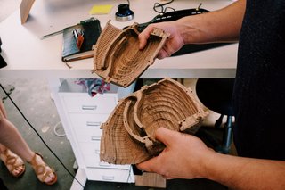 Craft & Vigor:
Inside Design at Grovemade - Photo 3 of 9 - Sean Kelly showing off the CNC-routed ridges that form the innards of their new wood speakers.
