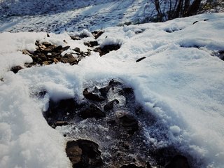 VSCO RAW/X and Topo Designs - Photo 9 of 9 - Ice and snow crust a rocky embankment.