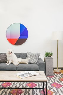 Vibrant primary colors meet cool grays and white in this sitting space.