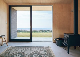The stark interior of the Muji Hut captures the essence of relaxation and focus.