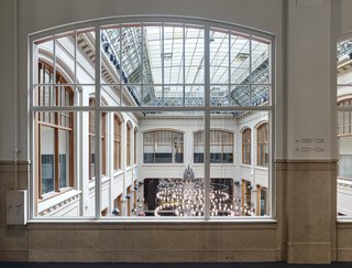 A former Amsterdam bank was transformed into a hotel, complete with a full restoration of the existing windows. Careful attention was paid to the windows and glass ceiling of the interior courtyard, so that new window panes blended in with old.