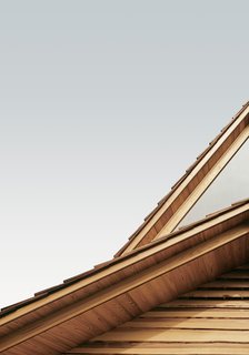 The Community-Run Cedar House by Airbnb and Go Hasegawa Welcomes Guests in Rural Japan - Photo 5 of 12 - The stacked outer eaves set in warm cedar contrast the cool, neutral grays of the Yoshino sky.