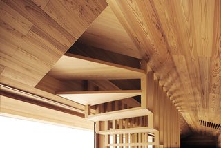 The Community-Run Cedar House by Airbnb and Go Hasegawa Welcomes Guests in Rural Japan - Photo 8 of 12 - The open airy design of the stairway is revealed—creating a unique pattern that is reflected in staircase railings and vents.