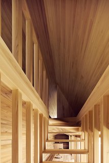 The Community-Run Cedar House by Airbnb and Go Hasegawa Welcomes Guests in Rural Japan - Photo 9 of 12 - The open staircase is seen here from the front—showcasing the dynamic lines that converge at the top of the stairway leading to the bedroom space.