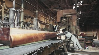 The Community-Run Cedar House by Airbnb and Go Hasegawa Welcomes Guests in Rural Japan - Photo 3 of 12 - Long beams are prepared by workers in a Yoshino factory, ready to be taken and used at the building site.