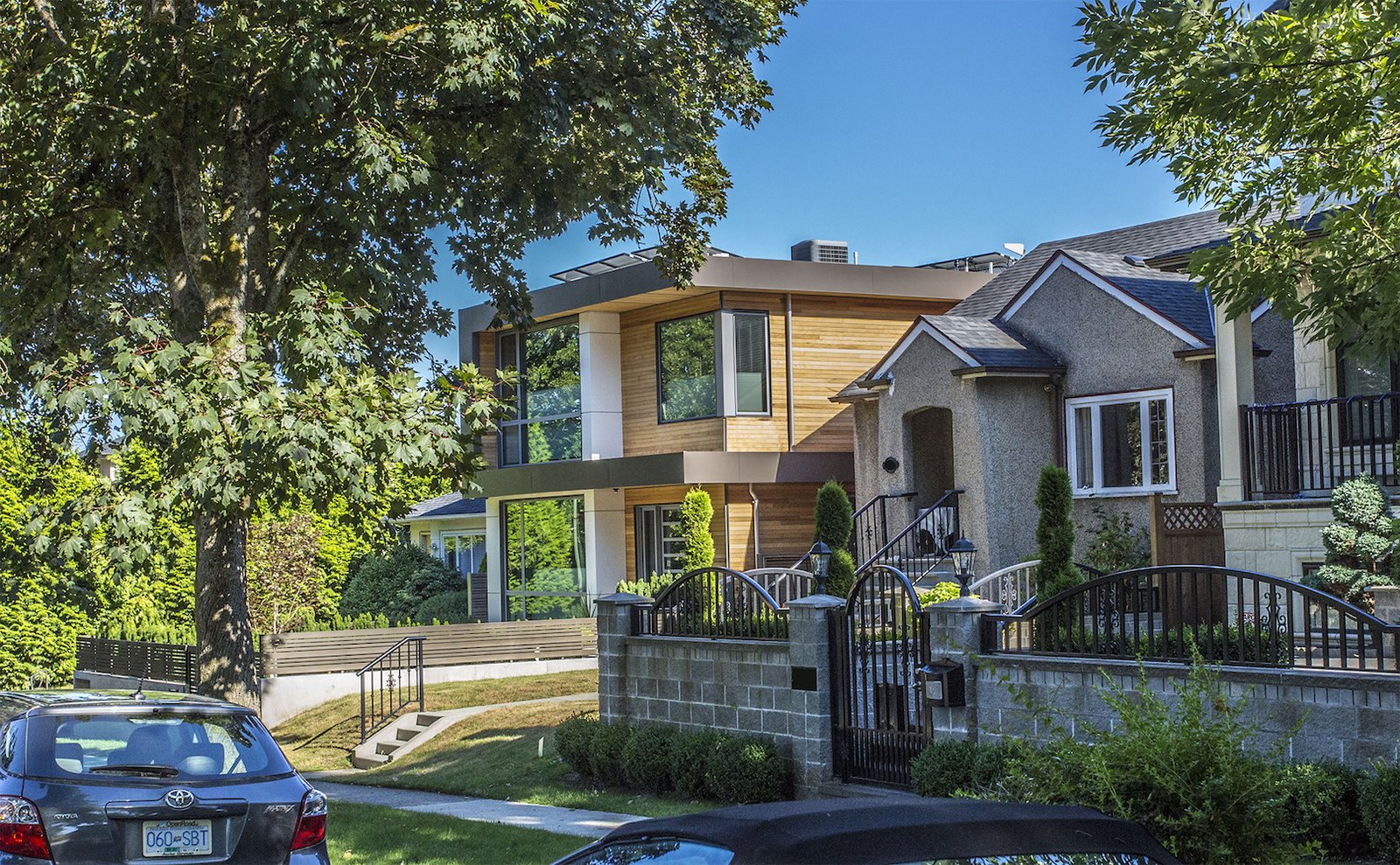 View from down the street of the C-House blending right in with its natural setting.