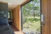 A conservation easement in favor of the Nature Conservancy prohibited permanent development so we customized two shipping containers off site, and then transported the new ‘cabin’ via truck to the property. Together with the client, we chose an ideal landing spot next to an old creek bed, with sunset views of Black Butte cinder cone. The cabin is completely off the grid and can be locked up tight when not in use. Photo 13 of Container Cabin modern home