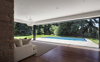 Ranch Reprise - Photo 3 of 4 - Although the existing house has large expanses of glass oriented to the backyard, much of the openness had been altered with compartmentalized spaces and low ceilings. "The great thing about these one-story ranches is that they are built fairly simply, allowing for easy intervention," said architect Matt Lawton. Instead of altering the footprint of the house, they strategically subtracted walls and added glass. 