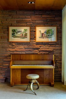 What Would Victor Do? - Photo 9 of 11 - One of many custom extravagances is<br>an upright piano that Victor Hornbein<br>convinced Steinway & Sons to manufacture<br>using veneers specified for the<br>house. Hanging above are watercolors<br>that Hornbein himself painted, elegantly<br>rendering his architectural vision. An<br>accomplished artist as well as architect,<br>Hornbein executed large murals around<br>Denver under the tutelage of legendary<br>muralist Allen Tupper True.