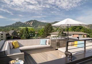 The NewTechWood composite rooftop deck has 360-degree views that include the Front Range and downtown Boulder. "I call the deck ‘the icing on the cake,’" said the homeowner. The custom furniture was built to be large enough to allow for easy slumber parties (for both adults and kids) under the stars. 