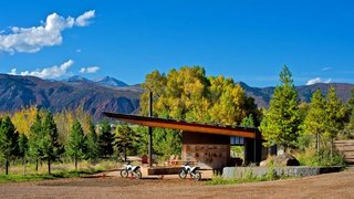 16 Inviting Countryside Cabins - Photo 16 of 16 - Black Shack Architects designed a modern motocross shelter in an elemental way.<br>When Glenn Rappaport’s long-time client approached him to design a shade structure along a private motocross track in El Jebel, Colorado, he was inspired by the elemental nature of the project. The family, with three teenage boys, wanted a shelter that would provide protection from the elements, a small changing area, restroom, fire pit, and storage for cold drinks.