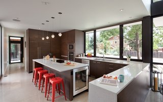 The open kitchen was built by Hammerwell of Boulder, an interior/exterior building firm. The corner lot is set back from the street and doesn't overpower surrounding homes, per strict residential codes and the careful execution of the Arch11 / Hammerwell team.