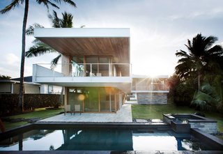 Aloha Koloa - Photo 2 of 8 - The house's L-shaped form creates a dialogue in which the yard becomes an integral, outdoor room for the home. Designed with walls and windows that "disappear" when opened, the architectural elements reinforce the Hawaiian lifestyle in which lines are consistently blurred between the time spent indoors and outdoors.