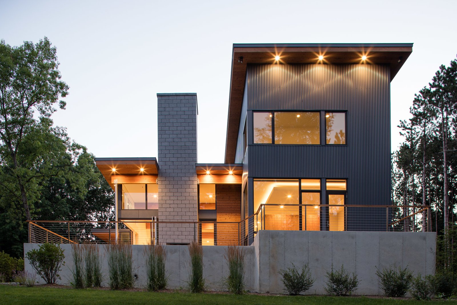 The taller mass holds the sleeping spaces, while the living and gathering spaces are located in the lower elements.