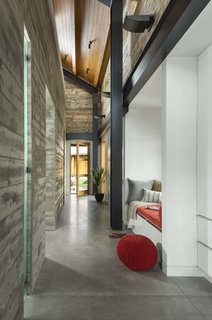 A Yurt-Inspired Vacation Home on the High Desert Plains of Colorado - Photo 3 of 8 - The central building connects the entry with the kitchen via long hallways. Concrete floors throughout the home—as well as the concrete center structure—keep the home cool in the summer and warm in the winter.