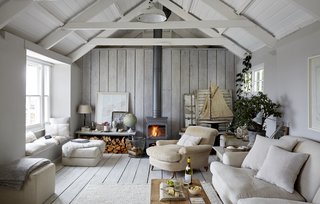 Escape For a Weekend Away at One of These Cornish Retreats That Fuse Old and New - Photo 7 of 14 - The Oyster Catcher is a 17th-century net loft on the harbor's edge in the town of Mousehole. It was given new life by interior designer Paul Massey with pendant lights, Siberian goose down, and soft, warm linens. 