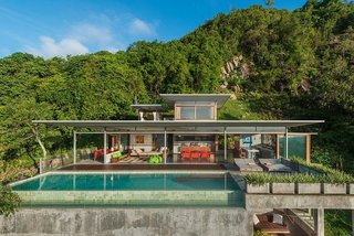 Escape to the Jungle in One of These Modern Forested Retreats - Photo 1 of 10 - Built by architect and photographer Mark Gerritson, The Naked House is a stunning six-bedroom minimalist villa on the Thai island of Koh Samui with concrete floors and plenty of outdoor space. It's available to rent through Airbnb.