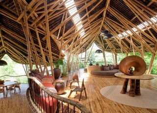Escape to the Jungle in One of These Modern Forested Retreats - Photo 8 of 10 - Built almost entirely with locally-sourced bamboo, the Green Village residential community in Ubud, Bali, is a sculptural house designed by Elora Hardy of Ibuku. It's available to rent through Airbnb.