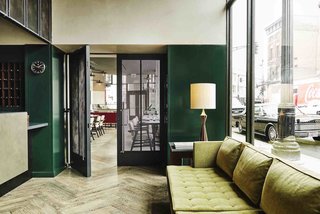 Designed by Nicolas Schuybroek Architects and Marc Merckx Interiors, The Robey is housed in a 1929 office building. Its mix of vintage and custom-made furnishings combines midcentury design with a touch of art deco. 