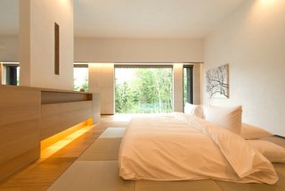 Hide Out in One of These Asian Retreats That Are Immersed in Nature - Photo 12 of 12 - Surrounded by forests and meadows, and close to some of Japan’s finest ski slopes, the 15 villas of Zaborin—a luxury ryokan in Hokkaido’s Hanazono woods—come with indoor and outdoor onsen baths that are filled with natural volcanic spring water.