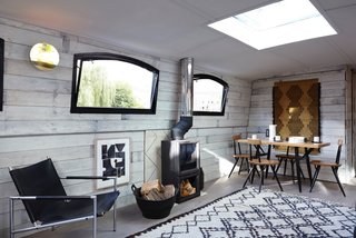 Make Yourself at Home in One of These Small Spaces on Boats That You Can Rent - Photo 2 of 10 - The London boutique barge hotel brand, Bert's Barges, offers the ultimate floating suites with simple and sophisticated Scandinavian interiors, wood-burning stoves, underfloor heating, bathrooms with walk-in showers, and a private roof terrace.