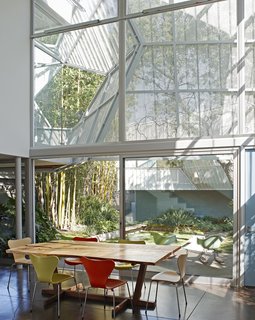 10 Homes With Large, Well-Ventilated Courtyards - Photo 3 of 9 - To create privacy, Kevin Daly Architects created a two-story glazed facade facing a landscaped courtyard, and shaded it with a perforated, folding metal skin that’s supported by an aluminum exoskeleton.
