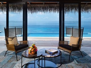 9 Modern Maldivian Resorts With Spectacular Overwater Villas - Photo 4 of 9 - Located in the Noonu Atoll, the contemporary villas on this island resort were inspired by the shape and patterns of sea turtles, and was built using locally-sourced materials.
