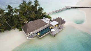 9 Modern Maldivian Resorts With Spectacular Overwater Villas - Photo 5 of 9 - This resort offers two types of overwater villas: the Water Villa, which has multiple terraces hanging above the sea, and the Garden Water Villa, which dips into the lagoon on one side while facing a lush tropical garden on the other. 