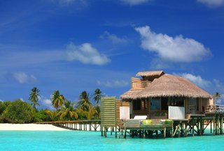 9 Modern Maldivian Resorts With Spectacular Overwater Villas - Photo 8 of 9 - Barefoot luxury is the order of the day at this palm-fringed paradise that will have you spending plenty of time in the water. 