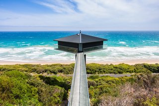 Rumored to be one of the most photographed homes on the Great Ocean Road, this house is suspended 131 feet above Fairhaven Beach. Designed by F2 Architecture, the house balances atop a concrete platform supported by a 42-foot-high plylon and is accessible via a narrow bridge. 